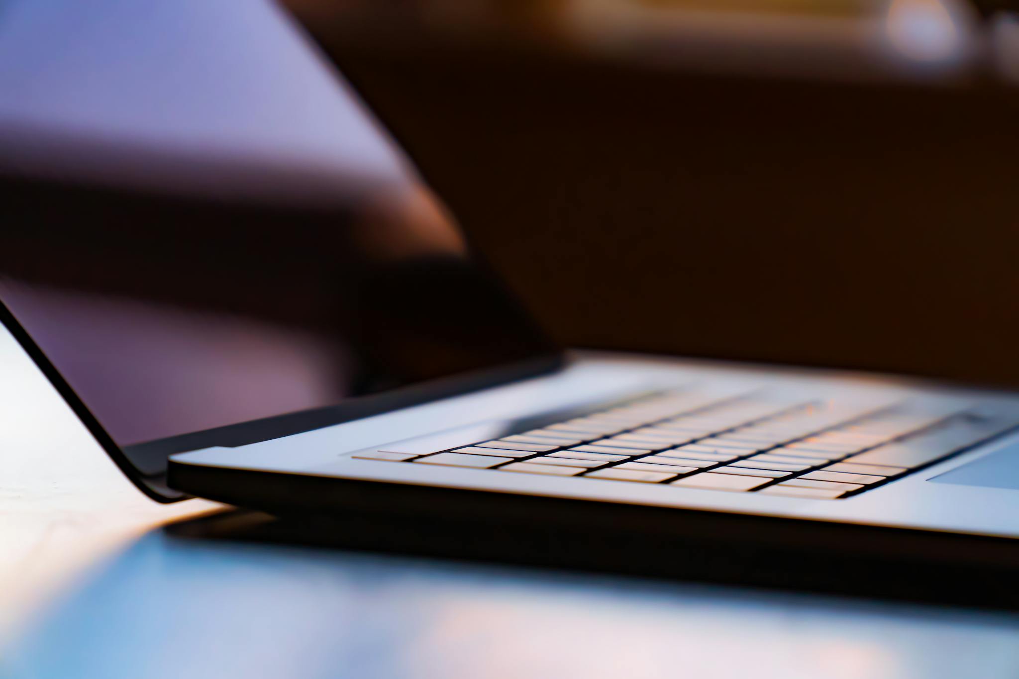 A detailed view of a laptop keyboard with shallow depth of field.